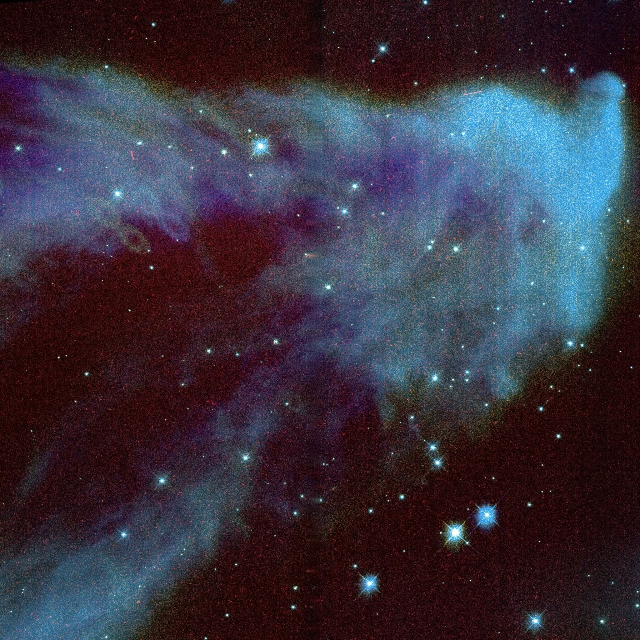 The Ghost of Cassiopeia (IC63) from Hubble WFC3 data reprocessed by Kyle Eberly — a hooked blue-white wisp of gas rising out of a deep-red hydrogen field, flecked with sharp blue stars.