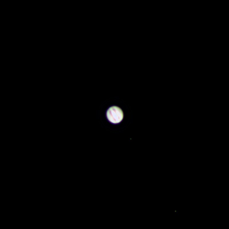 Jupiter photographed from Lakeway, Texas with a ZWO Seestar S50 — a tan-and-cream disk with red-brown equatorial cloud bands resolved, reprocessed from the raw 16-bit planetary stack.