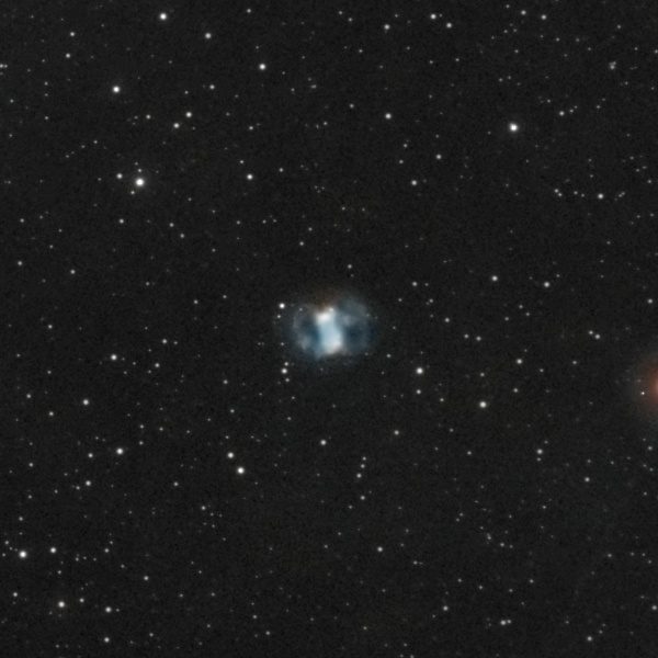 The Little Dumbbell Nebula (M76) photographed from Lakeway, Texas with a ZWO Seestar S50 — a small blue-white two-lobed planetary nebula in a rich Perseus star field.