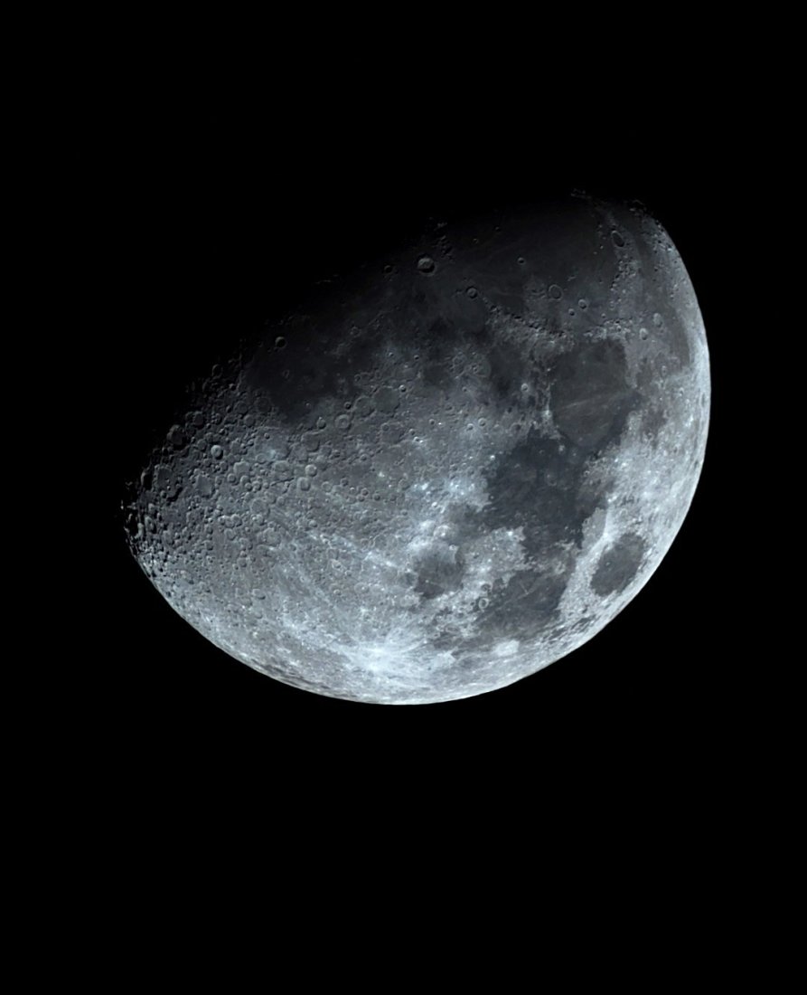 The waxing gibbous Moon photographed from Lakeway, Texas with a ZWO Seestar S50 — crater fields sharp along the terminator, dark maria plains, and bright ray systems across the illuminated face.