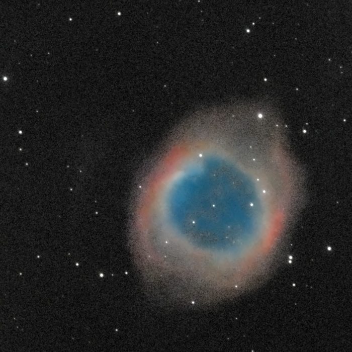 The Helix Nebula (NGC 7293) photographed from Lakeway, Texas with a ZWO Seestar S50 — a large ring-shaped planetary nebula with a teal-blue interior and salmon-red outer rim, resembling a giant eye against the star field.